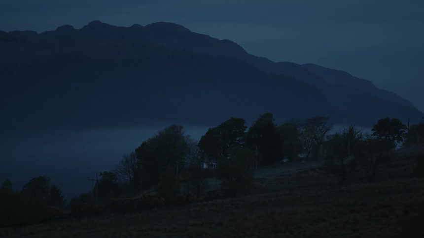 Heavy fog covers the mountain by the home