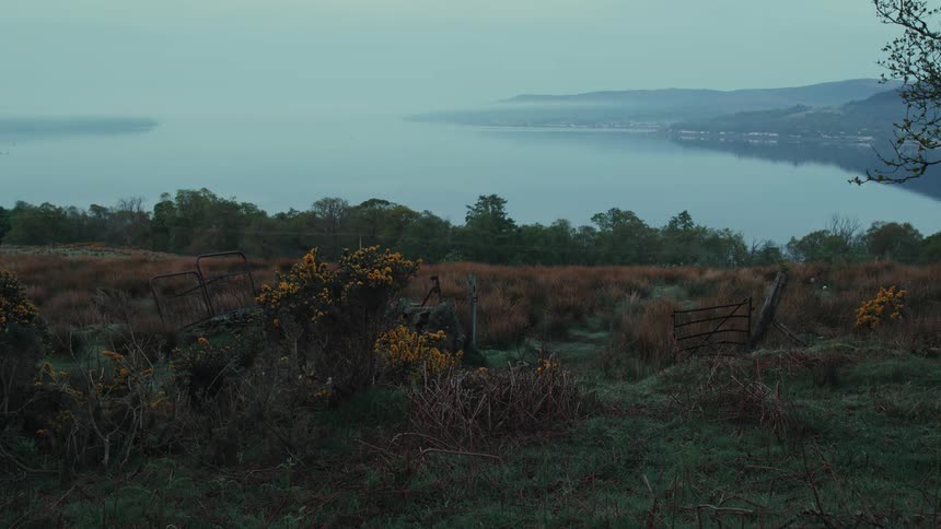 Green field on a mountain with sea view