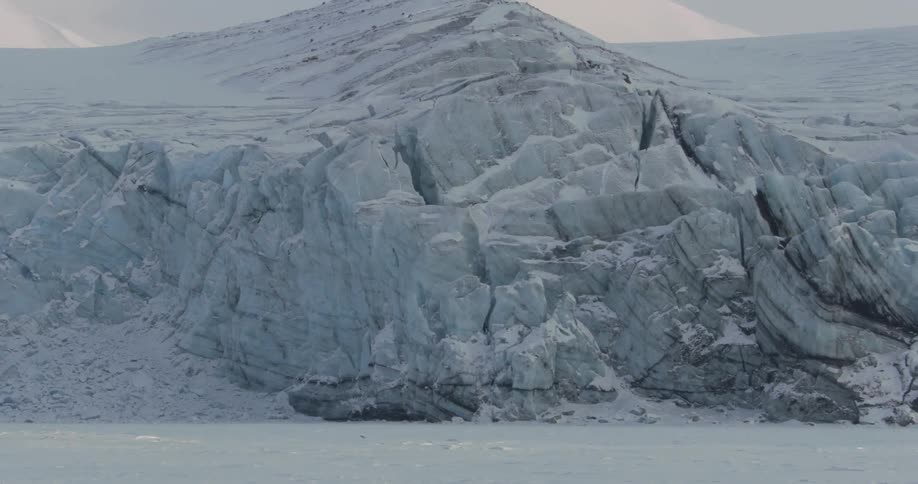 The mountain ahead is steep and covered with ice