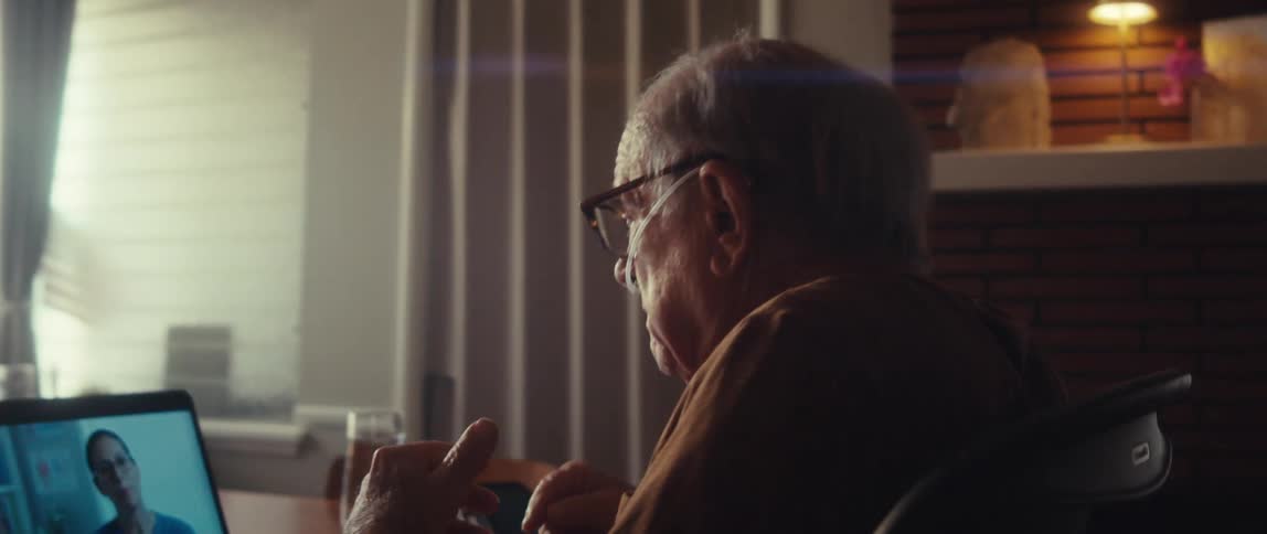 A man looks angry as he talks with someone on his laptop