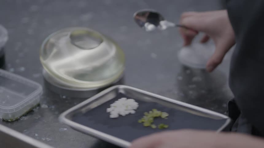 Pair of hands picking up spices