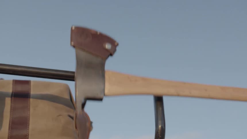 A person grabbing an axe