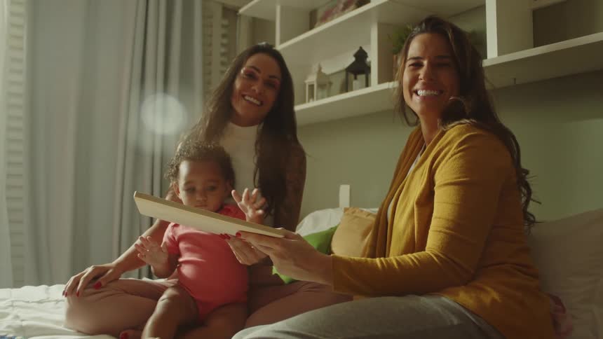 Smiling women with a little girl