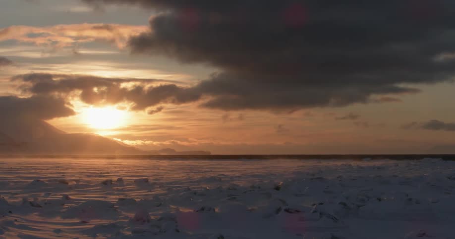 The sun shines on the icy landscape