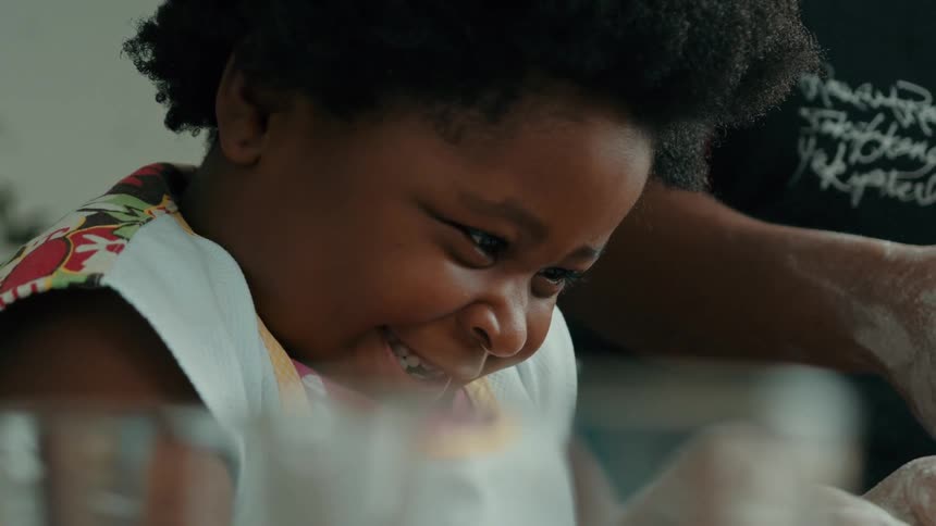 A girl is having fun cooking with flour