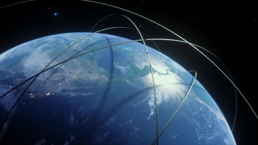 A computergenerated animation shows glowing lines representing a global communication network encircling the rotating earth as seen from space