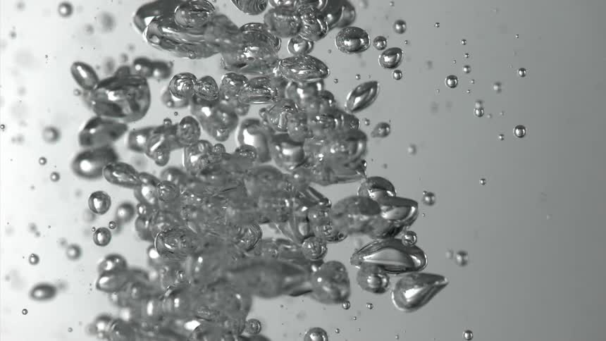 The bubbles rise and fall underwater