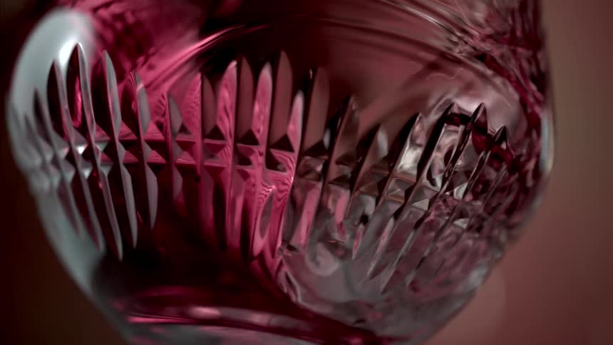 A glass of wine is being shaken