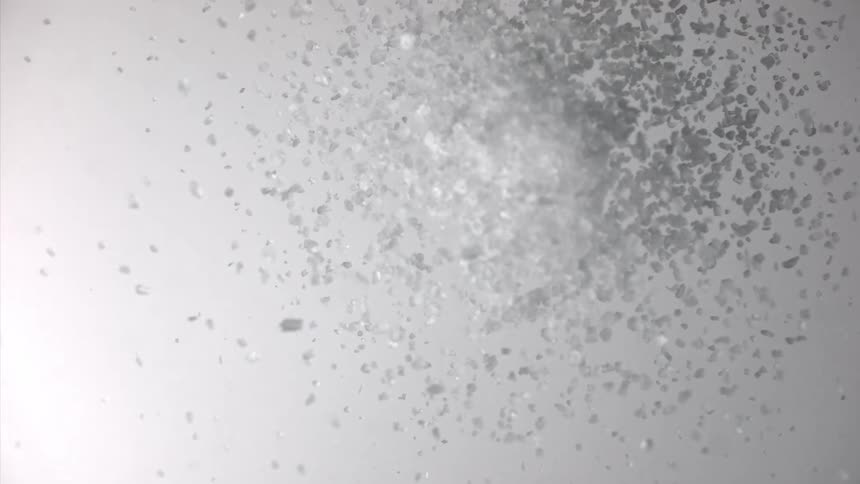 Water bubbles rise dramatically against a white background