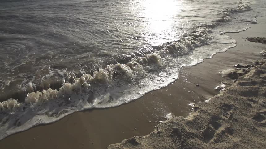 Waves crashing against the beach