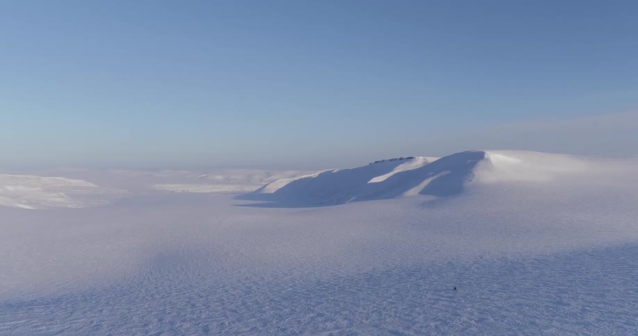 An expanse of snowy hills