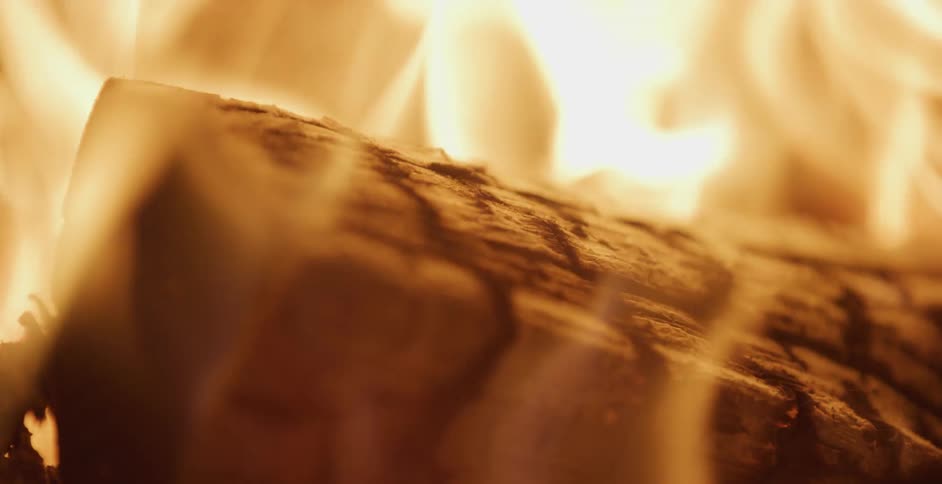 Close up of a single piece of lumbar surrounded by flames