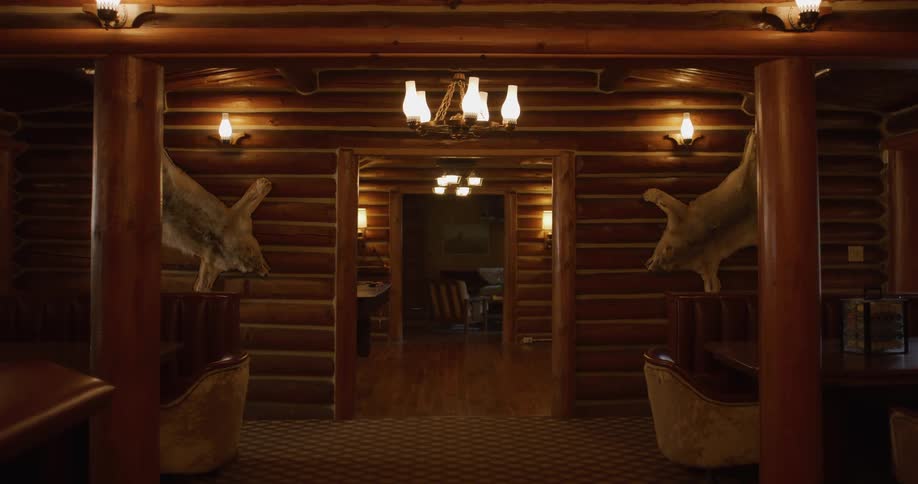 The log cabin has decorations on the wall