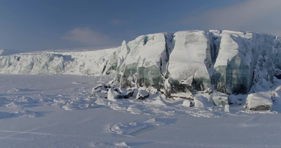 Ice mountains and snow covered ground in the arctic