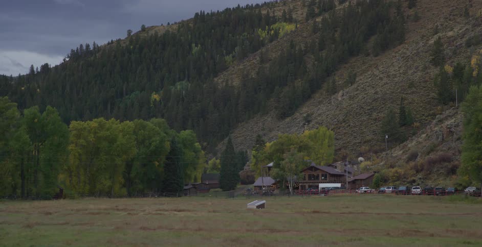 A car drive sup to the cabin on the ranch
