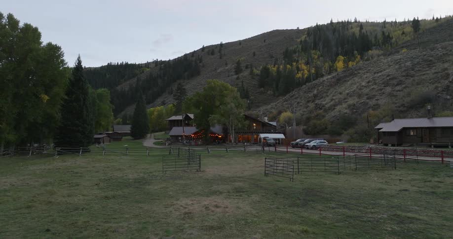 The barn and home are at the foot of a mountain