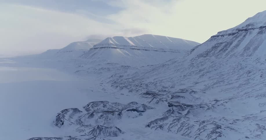 The mountain is lined with a long snowy field