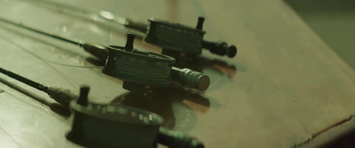 Fishing rods on a wooden table
