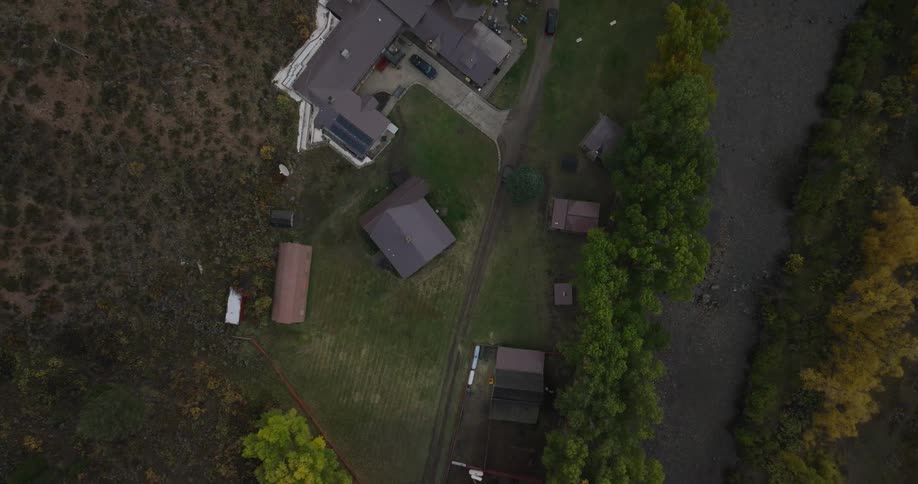 Aerial view of a rural neighborhood with scattered houses and trees