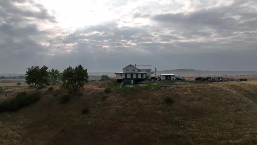 House in a secluded rural field on a cloudy day