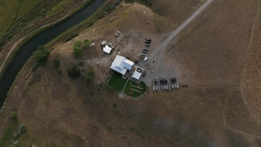 A house sits just off the river