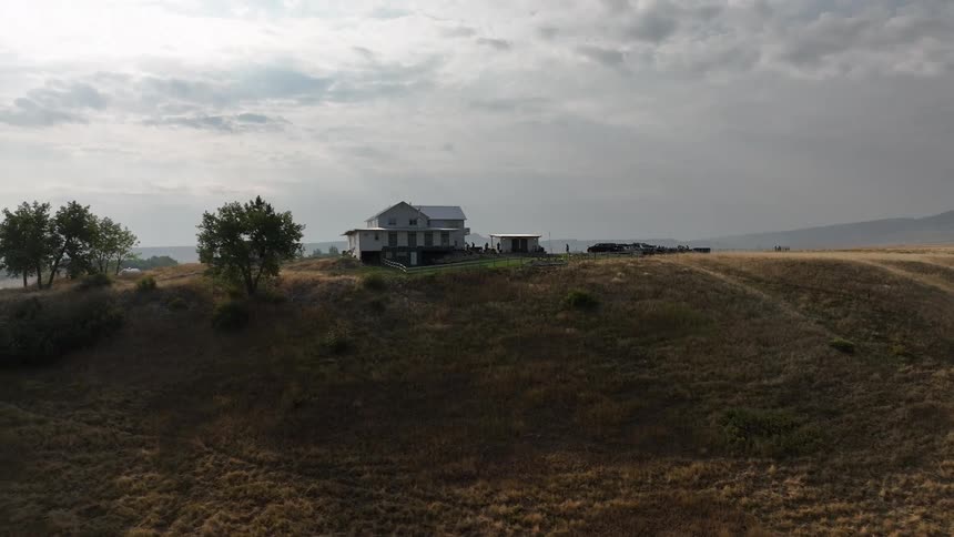 Isolated house and a hill in a natural environment on a cloudy day