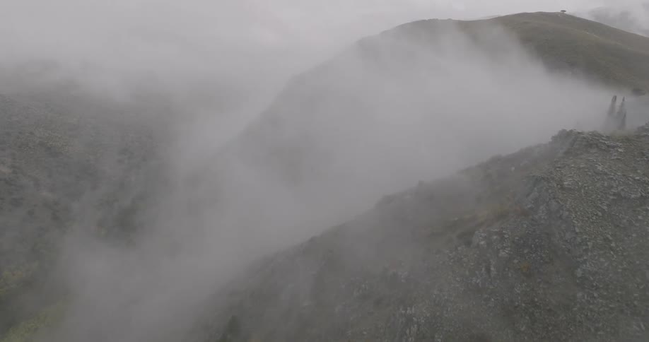 The clouds are covering the top of the mountain
