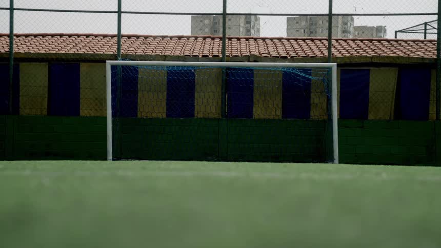 A goalpost on an outdoor soccer field during daytime