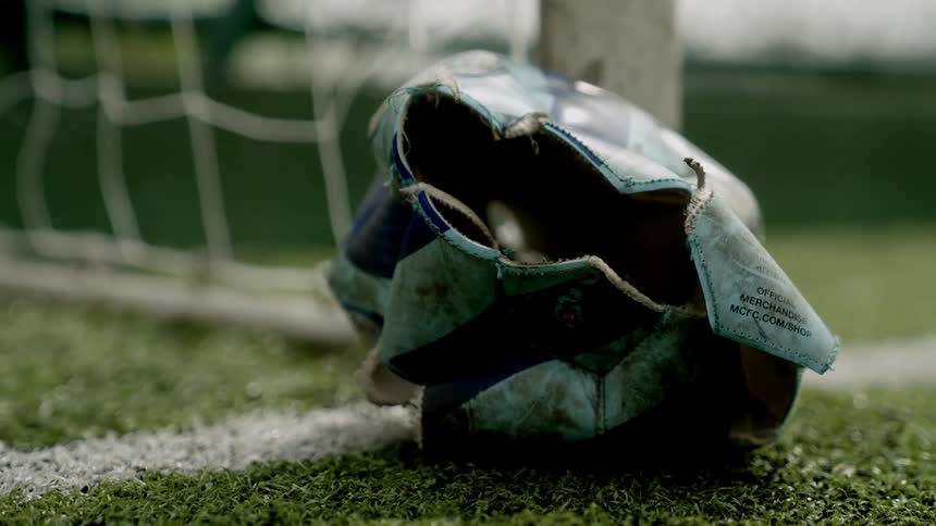 Punctured ball on a soccer field
