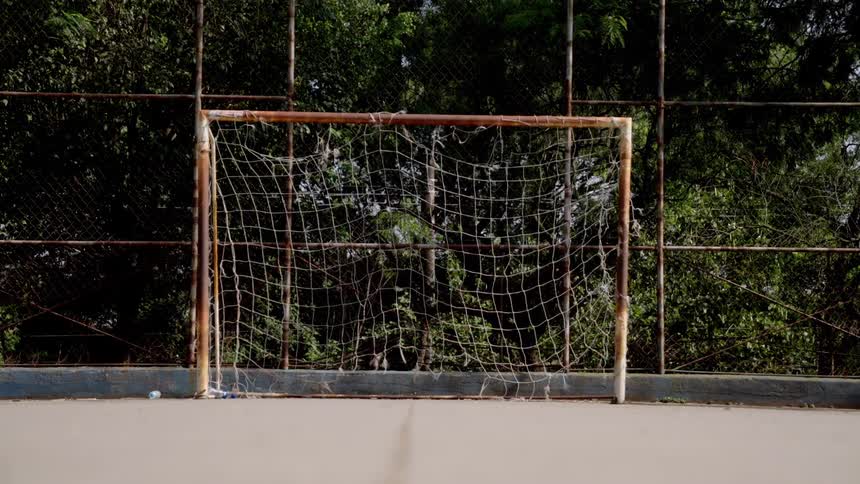 Outdoor court with a goal with a netted back