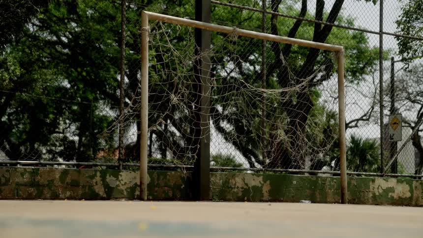 The soccer ball bounces off the net