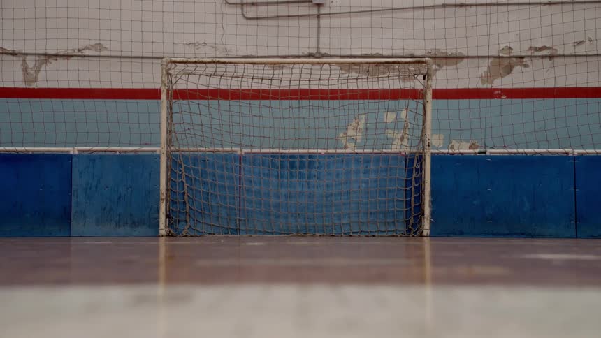A soccer net is in the empty auditorium
