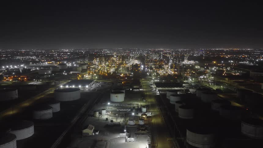 The landscape is covered with factories at night