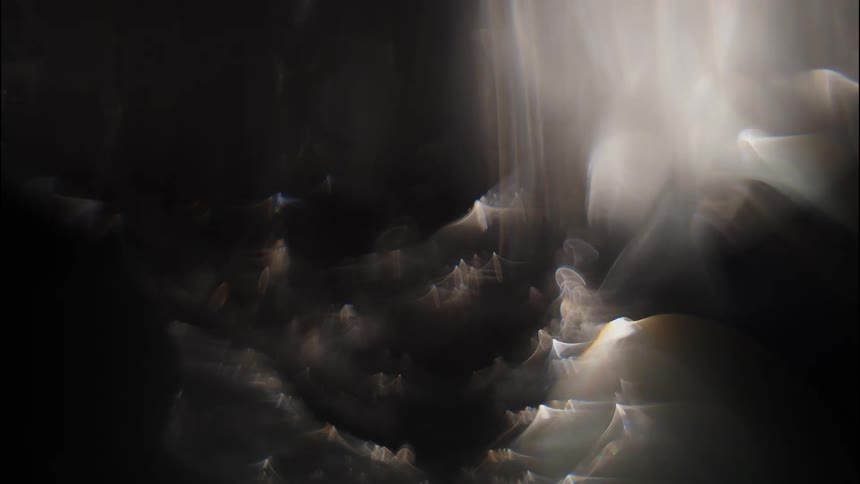 Abstract light beams and reflections create a dreamy ethereal effect