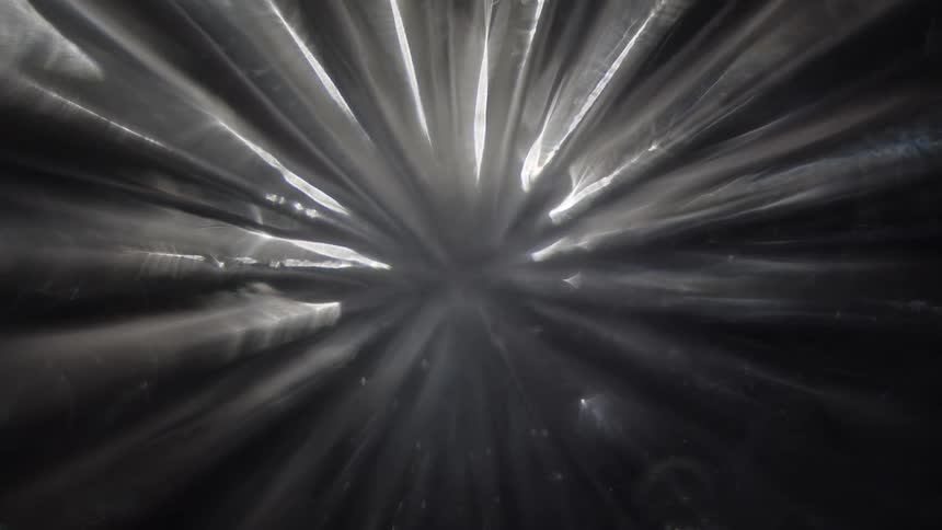 Abstract sharp reflections against a dark background