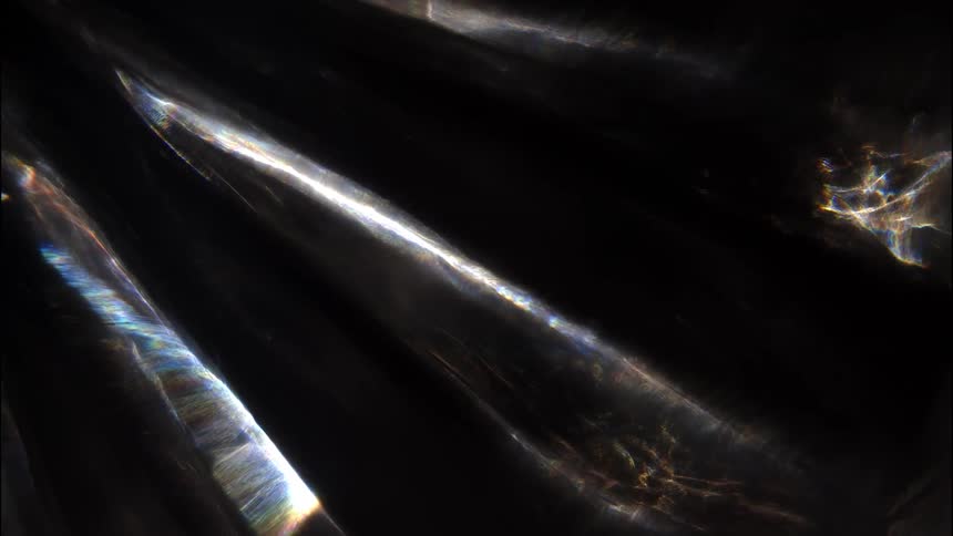 Dynamic and vibrant streaks of light cut across a dark background creating a mesmerizing abstract display the interplay of bright colorful highlights against the deep shadows suggests a dramatic and artistic visual effect