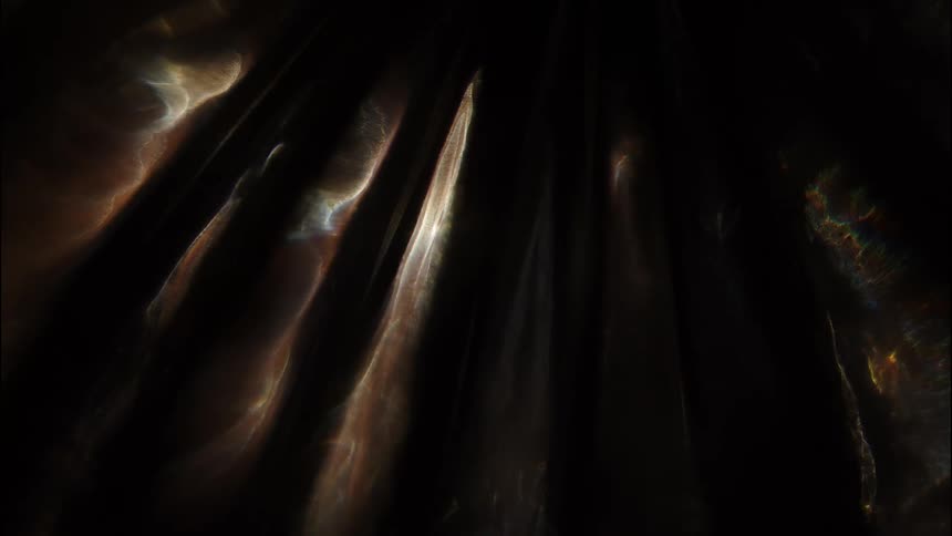 Reflections from water lighting up the walls of a cave