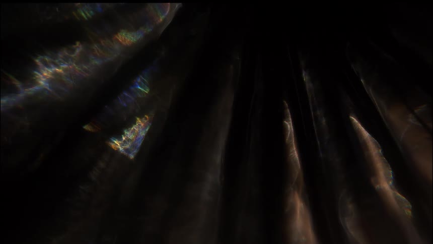 Reflections of natural light beams in a dark environment
