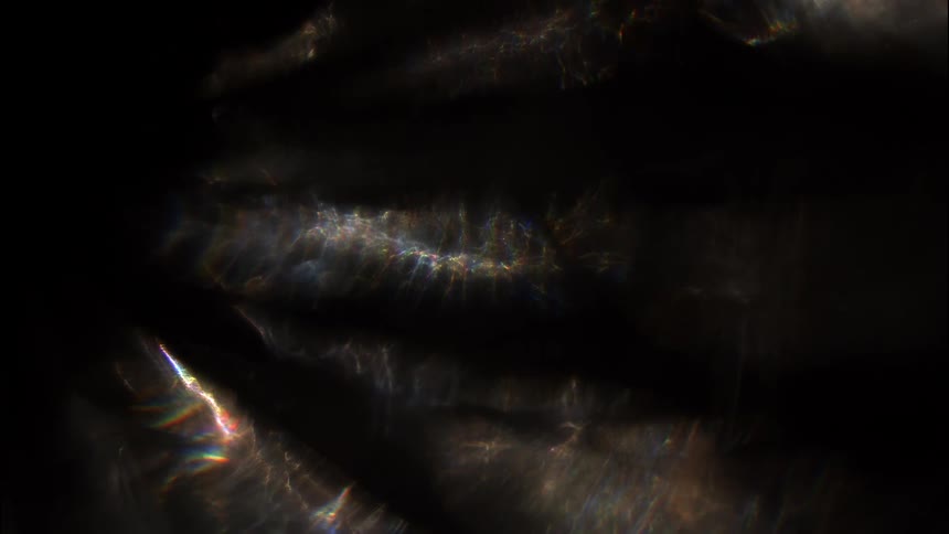 Abstract reflection of light against a dark background