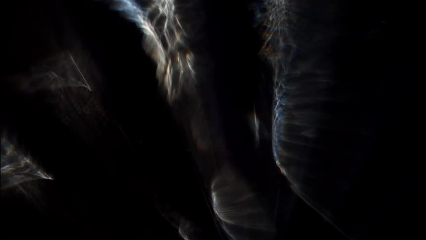 Abstract reflections of lights against a dark background