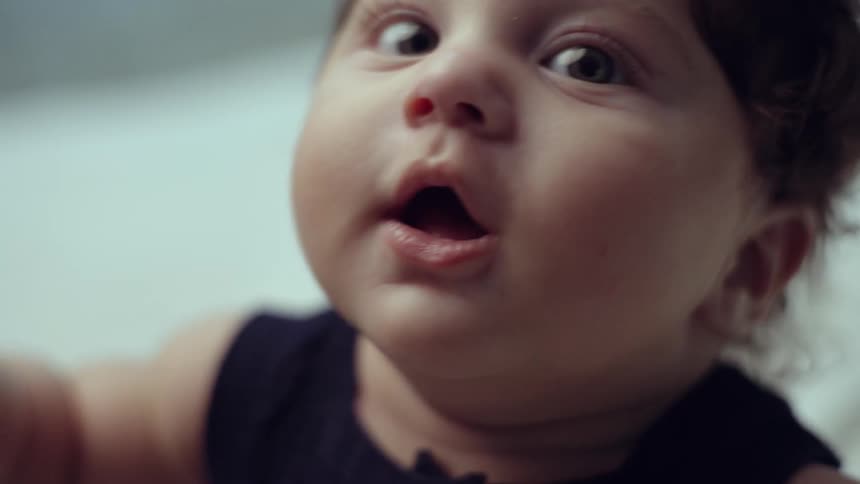 Portrait of a babys face balancing her body