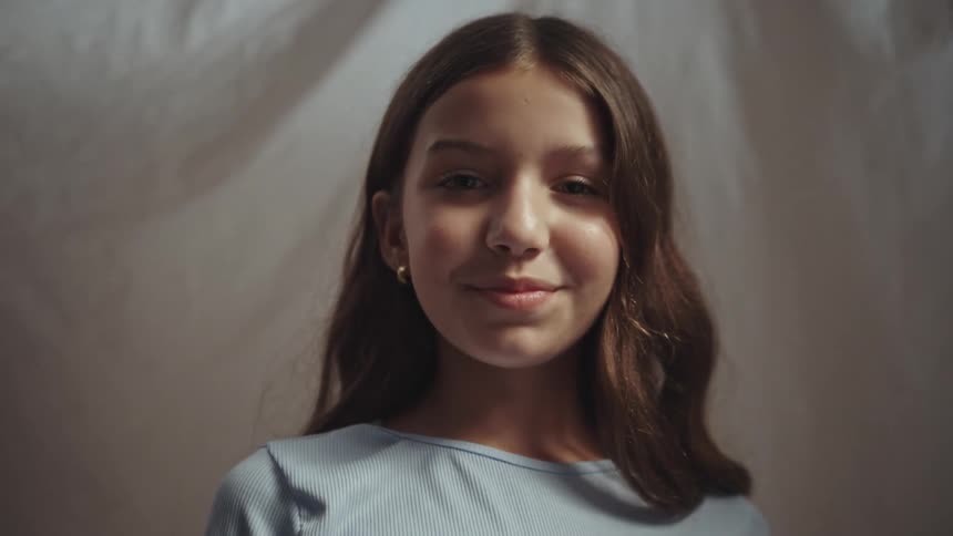 The girl gives a big smile