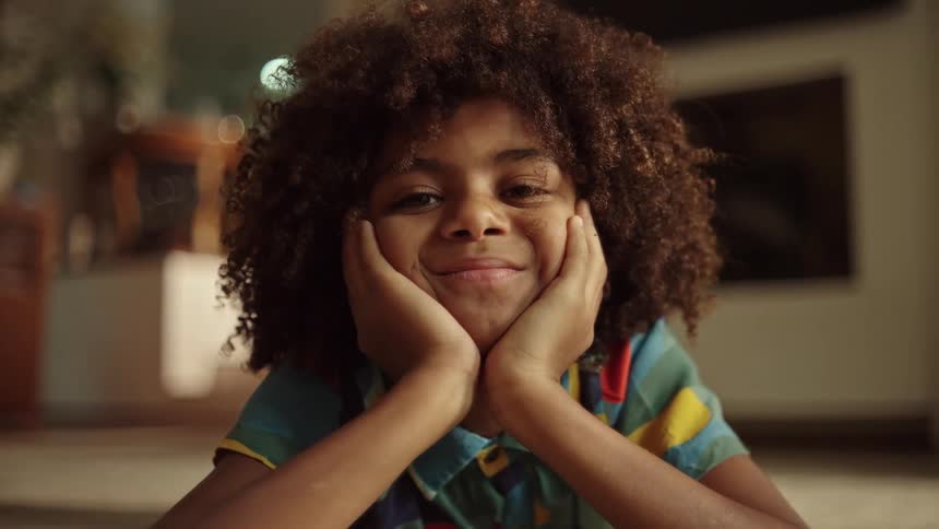 Curly haired boy with happy expression
