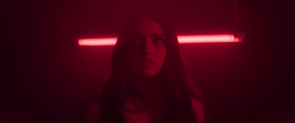 The girl is scared in the dark room