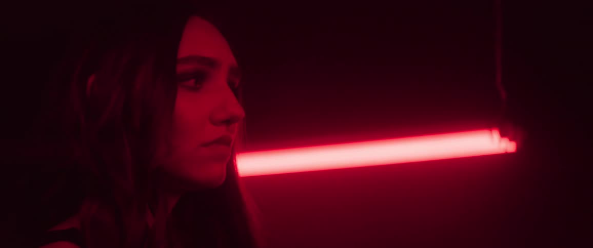 Woman in a dark room with red light