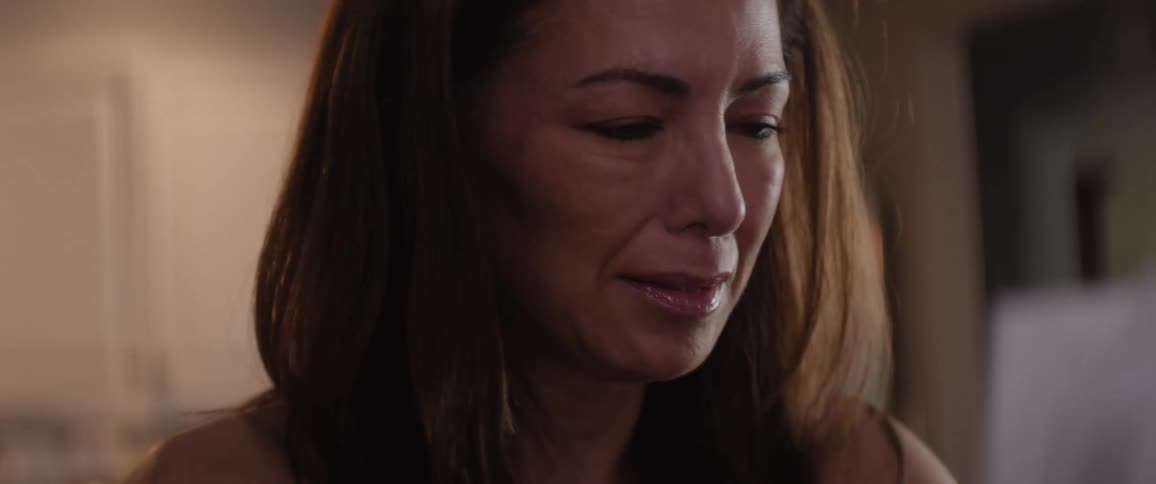 A woman gets very upset as she reads papers