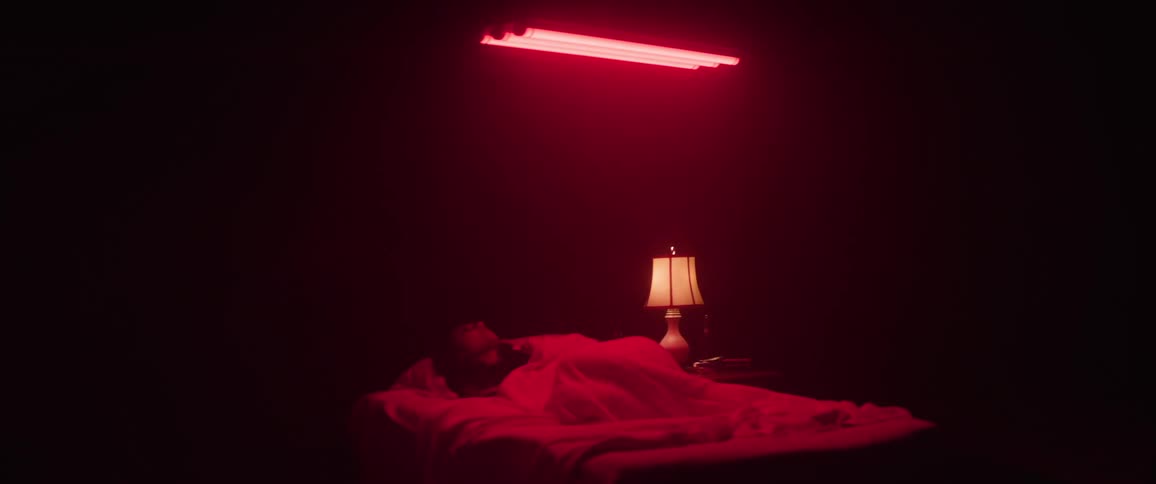 The girl turns while sleeping in bed