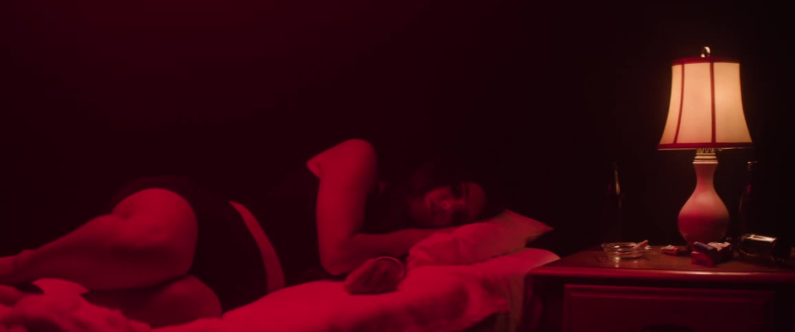 A woman lays in a bed