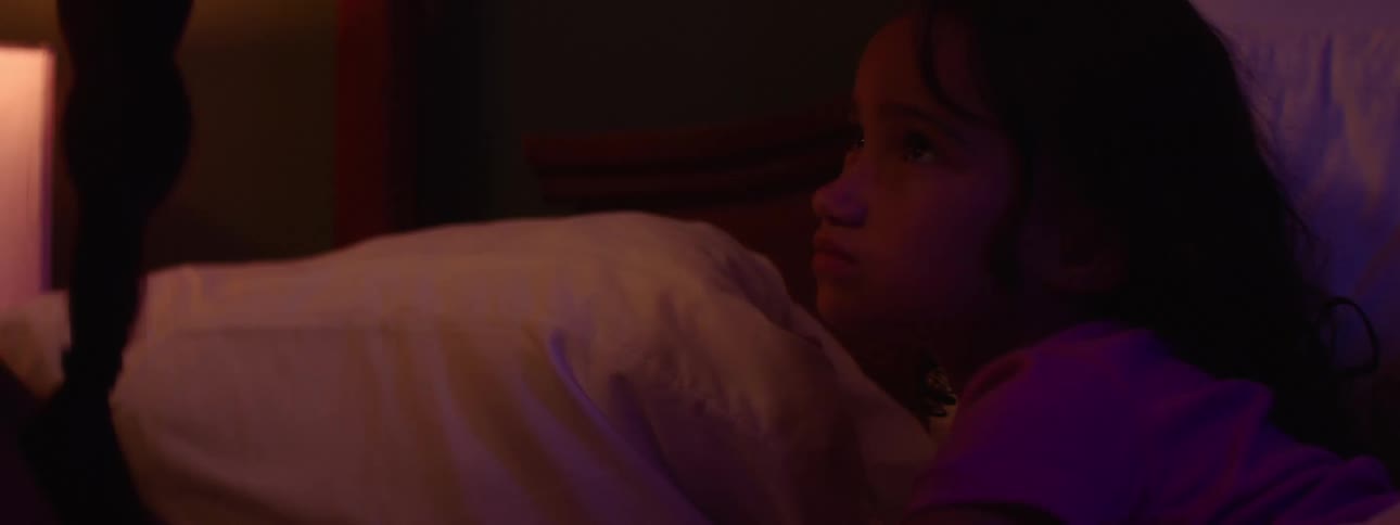 A little girl laying in bed begs her sister to make a pinky promise