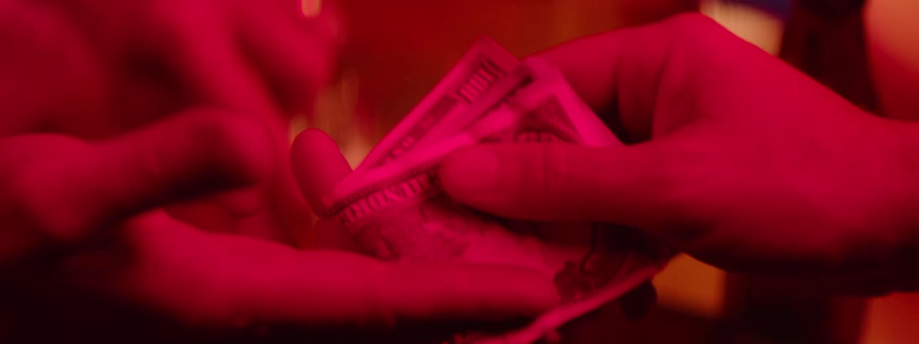 Cash is handing off to someone